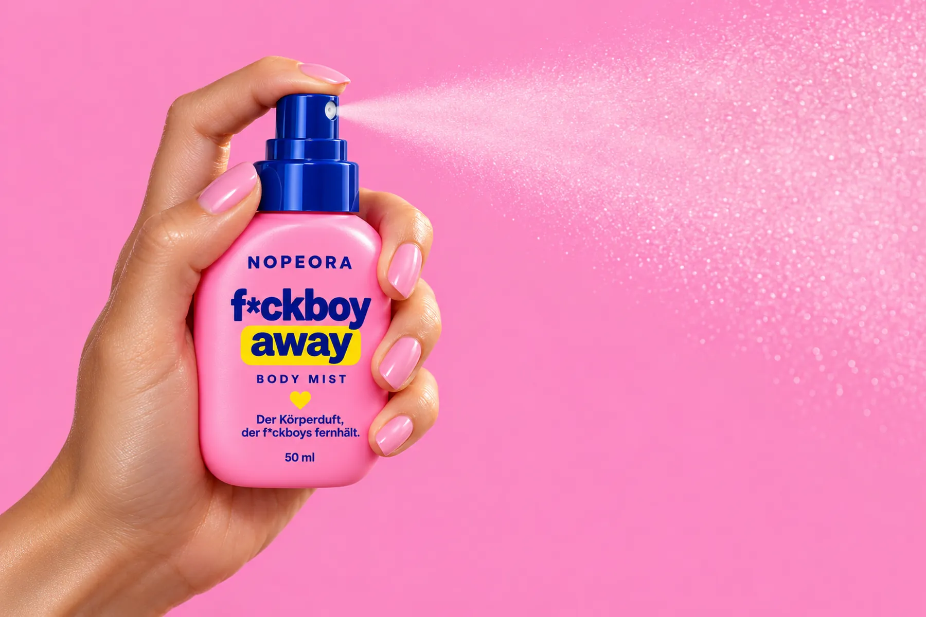 A hand with pink nails sprays the body mist, a fine mist drifting to the right